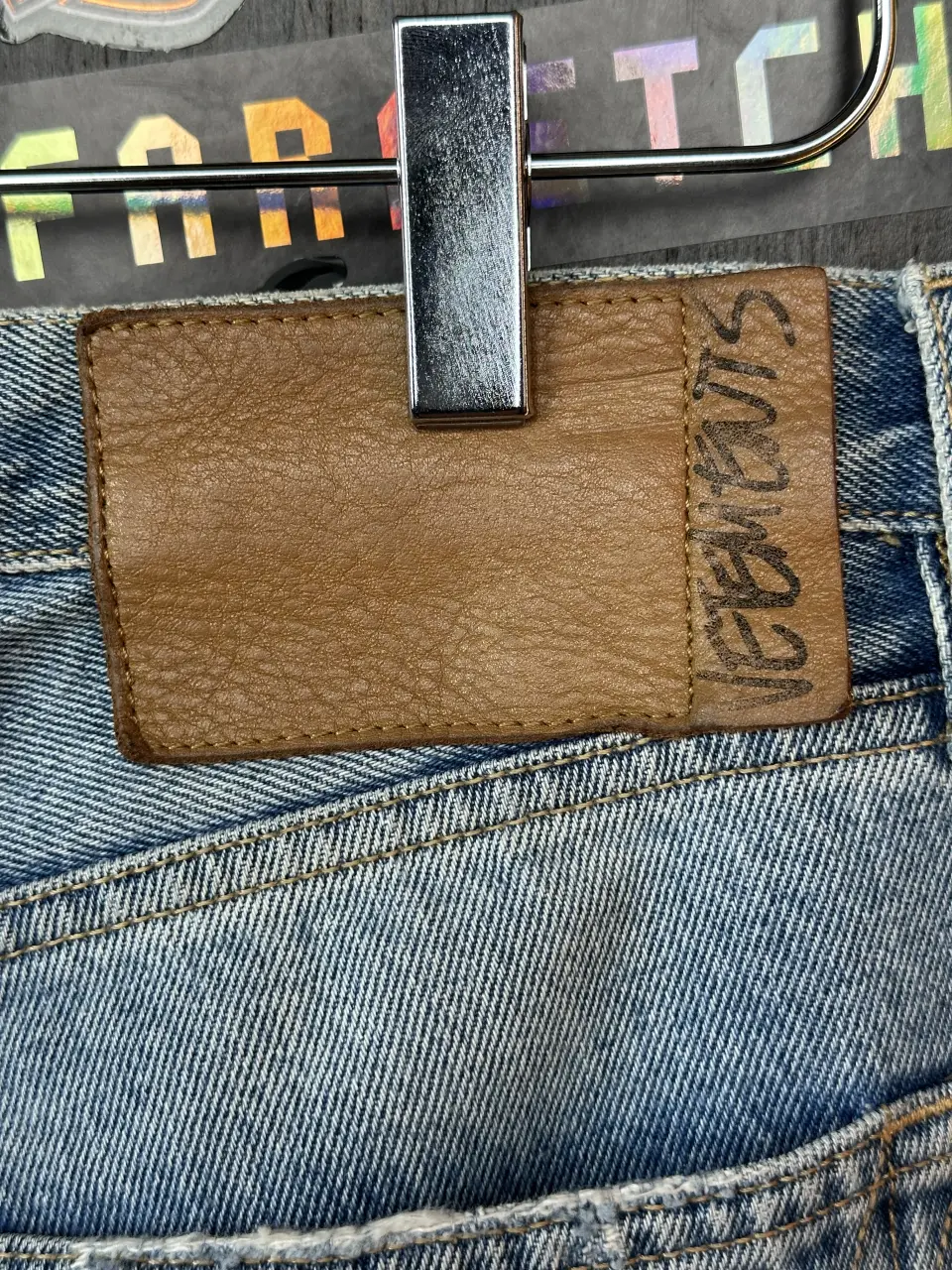 Vetements VETEMENTS FW19 Demna Anarchy Logo Distressed Blue Jeans, detail view 8