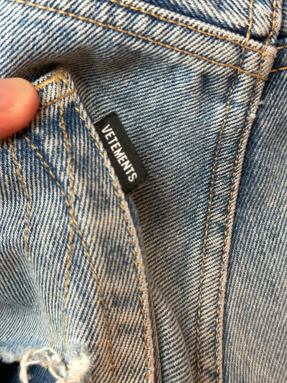 Vetements VETEMENTS FW19 Demna Anarchy Logo Distressed Blue Jeans, detail view 9