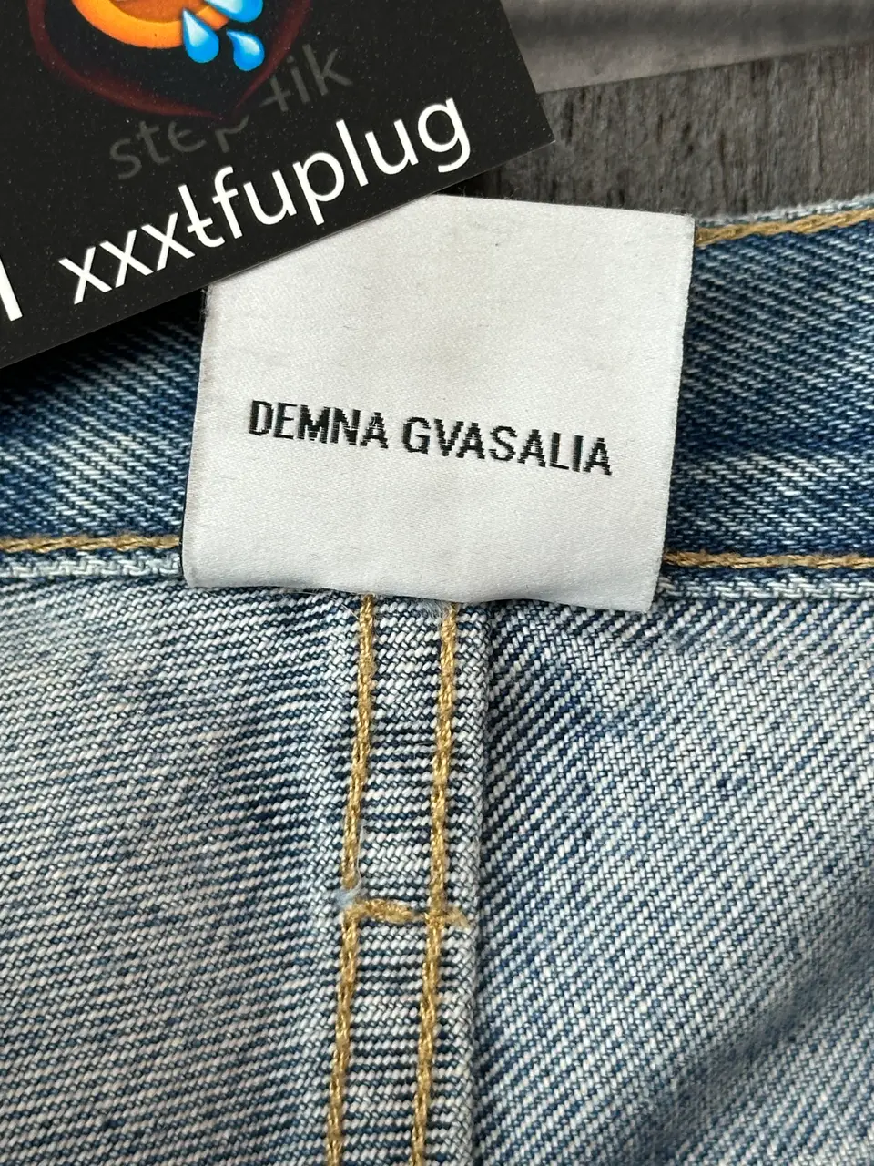 Vetements VETEMENTS FW19 Demna Anarchy Logo Distressed Blue Jeans, detail view 17