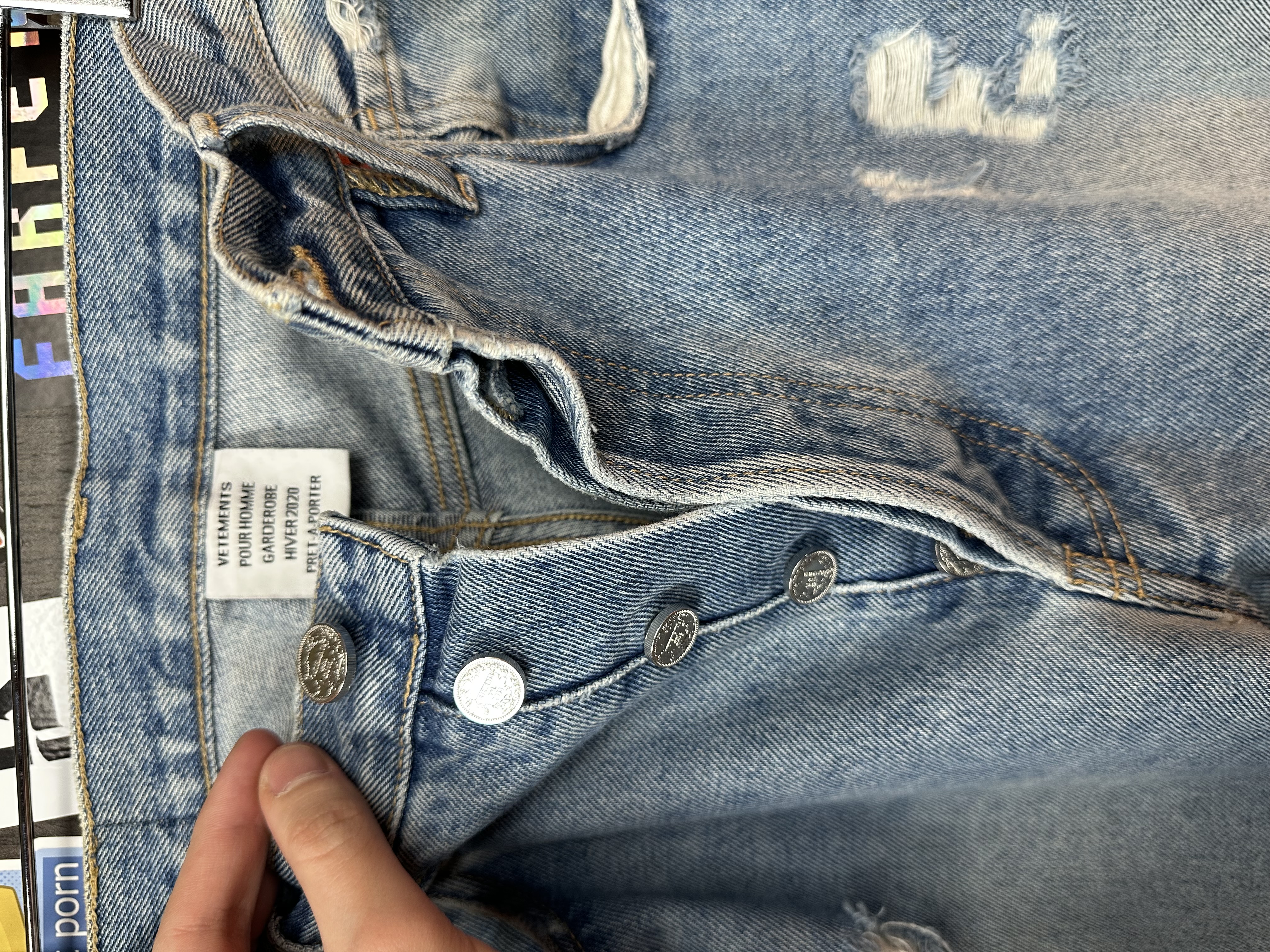 Vetements VETEMENTS FW19 Demna Anarchy Logo Distressed Blue Jeans, detail view 12