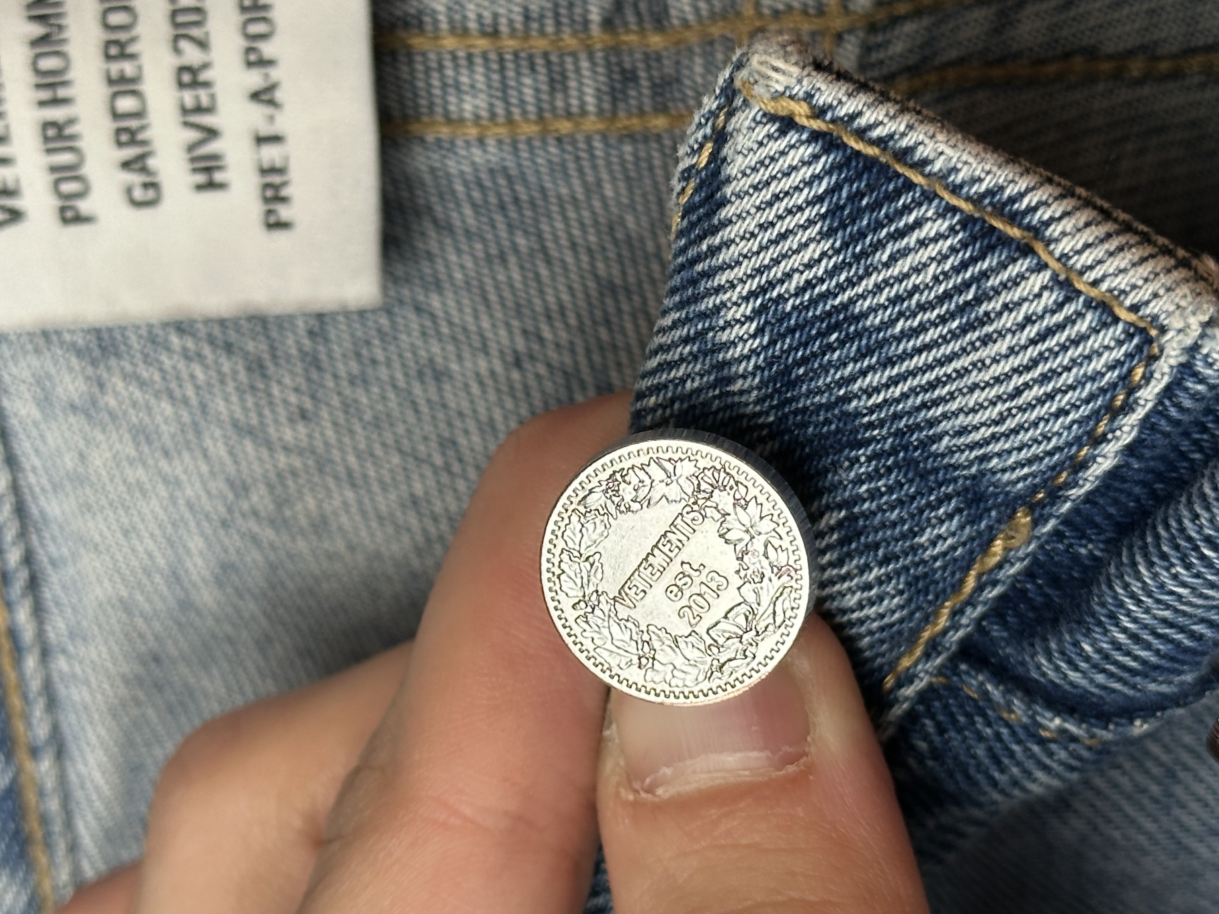 Vetements VETEMENTS FW19 Demna Anarchy Logo Distressed Blue Jeans, detail view 15