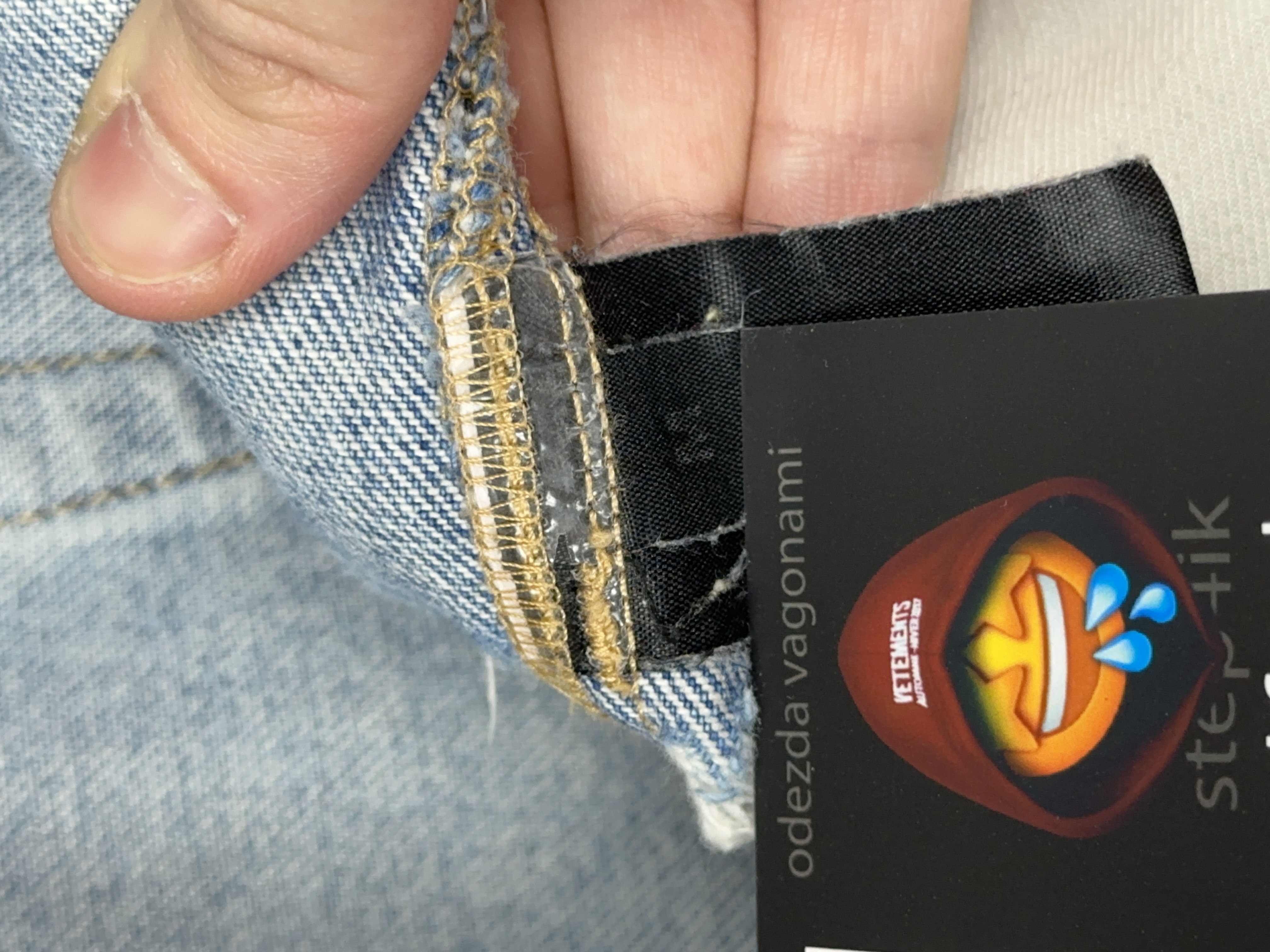 Vetements VETEMENTS FW19 Demna Anarchy Logo Distressed Blue Jeans, detail view 18